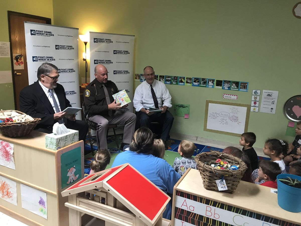 Rep Moolenaar and members reading with kids