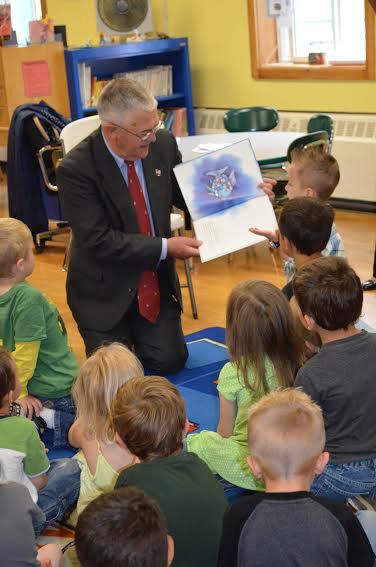 Major General Earl Adams, U.S. Army (retired) reading with PreK students in Bangor