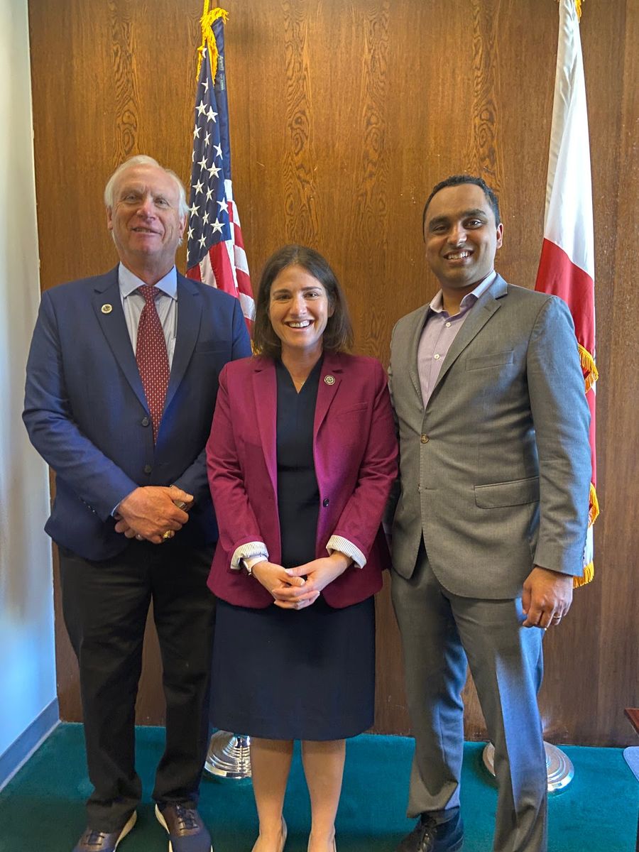 Rear Admiral Tim Sullivan, Assemblywoman Rebecca Baur-Kahan, and Dr. Farooq 